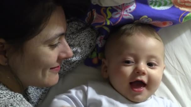 Mom Bonding Kissing Baby Infant Son Bed — Vídeo de Stock