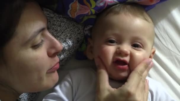 Casual Authentic Mother Baby Interaction Mom Squeezing Infant Son Cheeks — Video