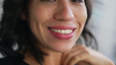 Closeup mouth smiling. One hispanic latin girl smile
