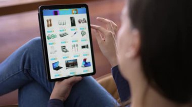 Closeup woman hands holding tablet shopping online store. Person buying products on the internet using device