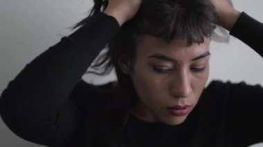 Closeup woman face with frustrated emotion pondering solution to problem