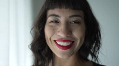 One beautiful hispanic girl portrait smiling at camera. Closeup face of a happy South American woman