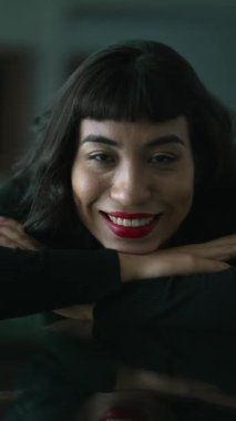 Young latin woman smiling at camera. Portrait of hispanic girl. Vertical Video