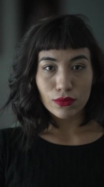 Portrait of a Brazilian latin woman with Native Indigenous traits descent. Vertical Video