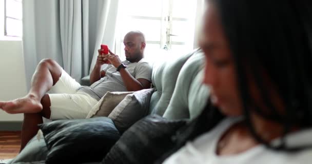 Teen Daughter Father Sitting Home Sofa Using Smartphone Device Each — Video