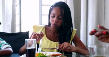 Black African girl eating lunch
