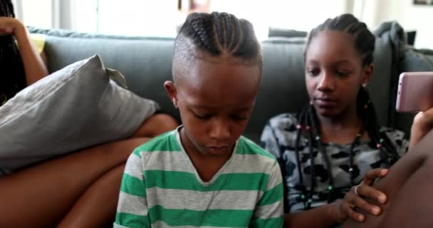 African Family Using Technology Home Sofa — Vídeo de stock