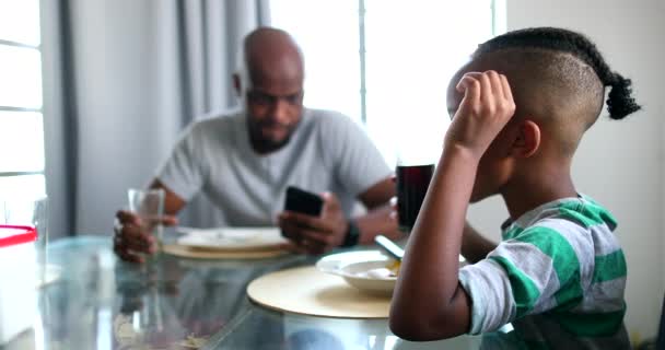 Candid Black African Family Eating Lunch Dad Putting Away Phone — Video Stock