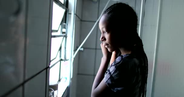 Black African Teen Girl Standing Window Putting Earrings — Stockvideo