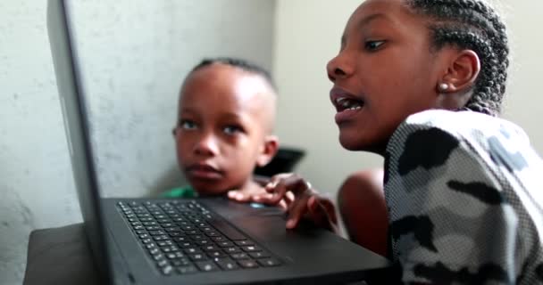 African Teen Girl Browsing Internet Laptop Little Brother Watching Next — Video Stock
