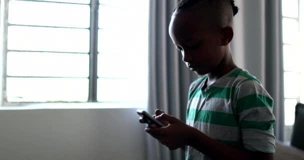 Child Holding Smartphone Device Mixed Race Black African Boy Kid — Stockvideo