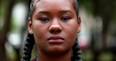 Serious African black ethnicity woman staring camera