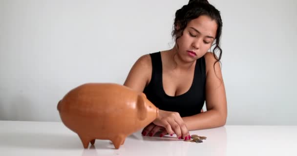 Young Woman Saving Money Putting Coins Piggy Bank — Vídeo de Stock