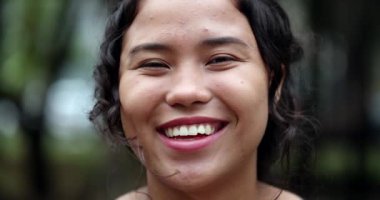 Hispanic woman portrait smile. Joyful casual teen girl laughing, real people series