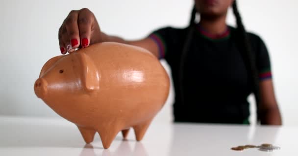 African Woman Putting Coins Piggy Bank Person Saving Money — Vídeo de Stock