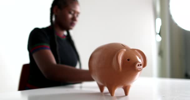 African Woman Putting Coins Piggy Bank Person Saving Money — Vídeo de Stock