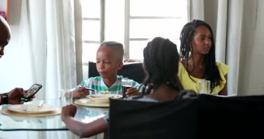 African ethnicity family at lunch time candid and casual