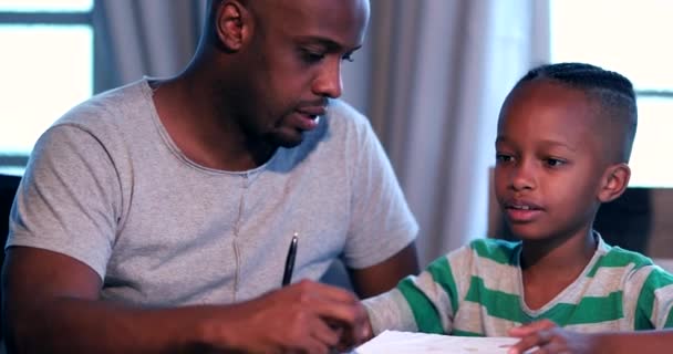 Little Boy Doing Homework Home African Father Helping Son Study — Vídeos de Stock