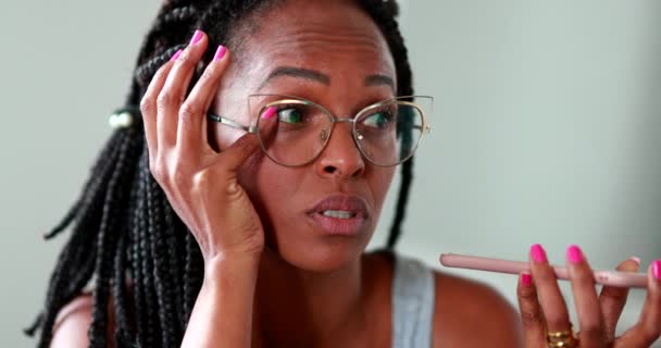 Black Woman Sending Voice Message Smartphone While Scratching Face — Stock Video