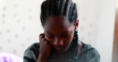 Pensive black teen girl. Thoughtful African american adolescent teenager in dilemma