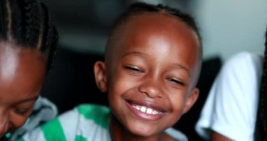 Happy children snacking eating sandwich. African kids