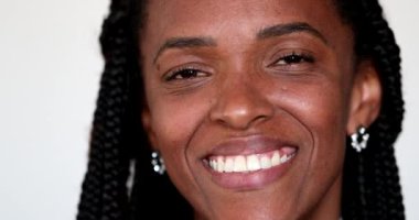 Happy African woman smiling at camera, face portrait, black person