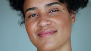 Portrait young black woman smiling at camera. African Brazilian hispanic girl