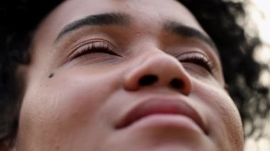 Woman smiling looking at the sky