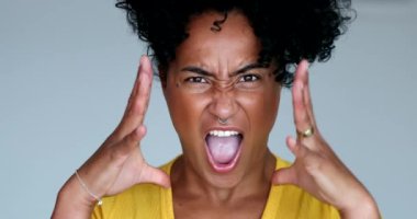 Upset angry young black woman yelling