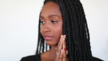 Pensive millennial black teen girl thinking