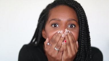Excited millennial teen girl positive shock reaction. Happy black adolescent girl