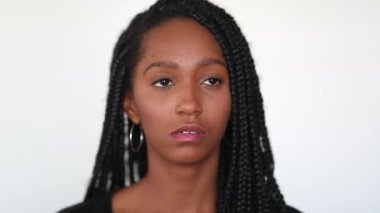 Pensive mixed race black teen girl on white background