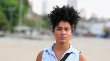 Serious Portrait young black woman staring at camera