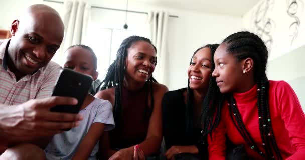 African Family Gathered Together Looking Cellphone — Stockvideo