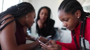 African black family in front cellphone
