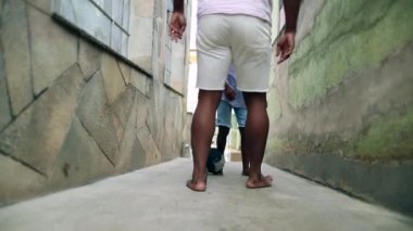 African father and child boy playing soccer
