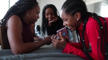 Family at home using cellphone, each individual alone together in social bubble