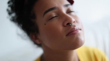 African woman praying at home with hope and faith