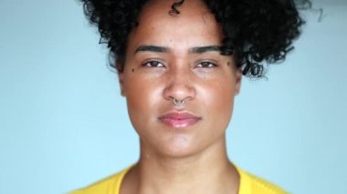Portrait young black woman staring camera