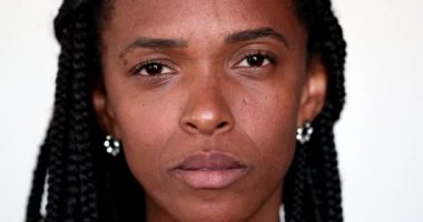 Portrait African black woman with serious expression looking at camera