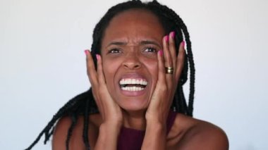 Dramatic black woman reacting with desperation