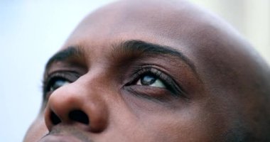 African man closing in meditation and contemplation, close-up black ethnicity eyes