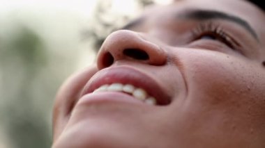 Woman smiling looking at the sky