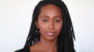 Mixed race hispanic black girl on white background portrait