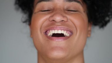 Young Brazilian woman authentic smile and laugh portrait face