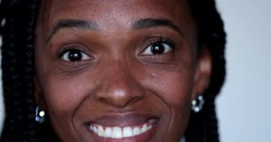 Casual black African woman authentic laugh and smile