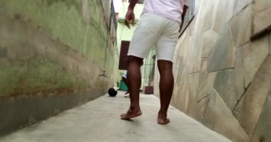 Kid playing ball with father