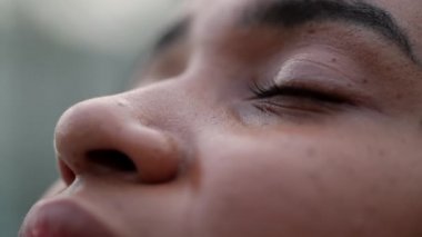 Woman eyes close-up looking at sky with hope and faith