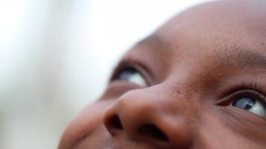 Happy beautiful black teen girl face looking at sky smiling