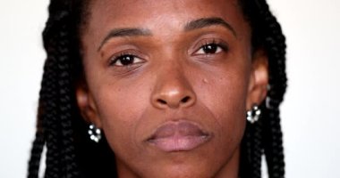 Serious African american black woman portrait staring camera, close-up face portrait